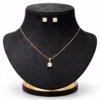 Elegant gold jewelry set on velvet shynel