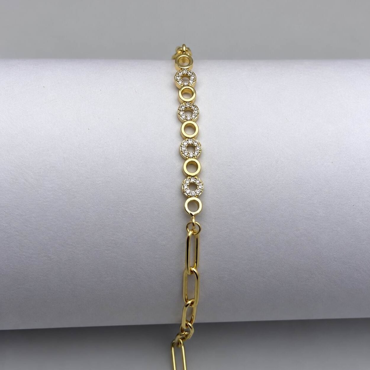 Gold chain bracelet with crystal Multi circle accents and adjustable clasp.