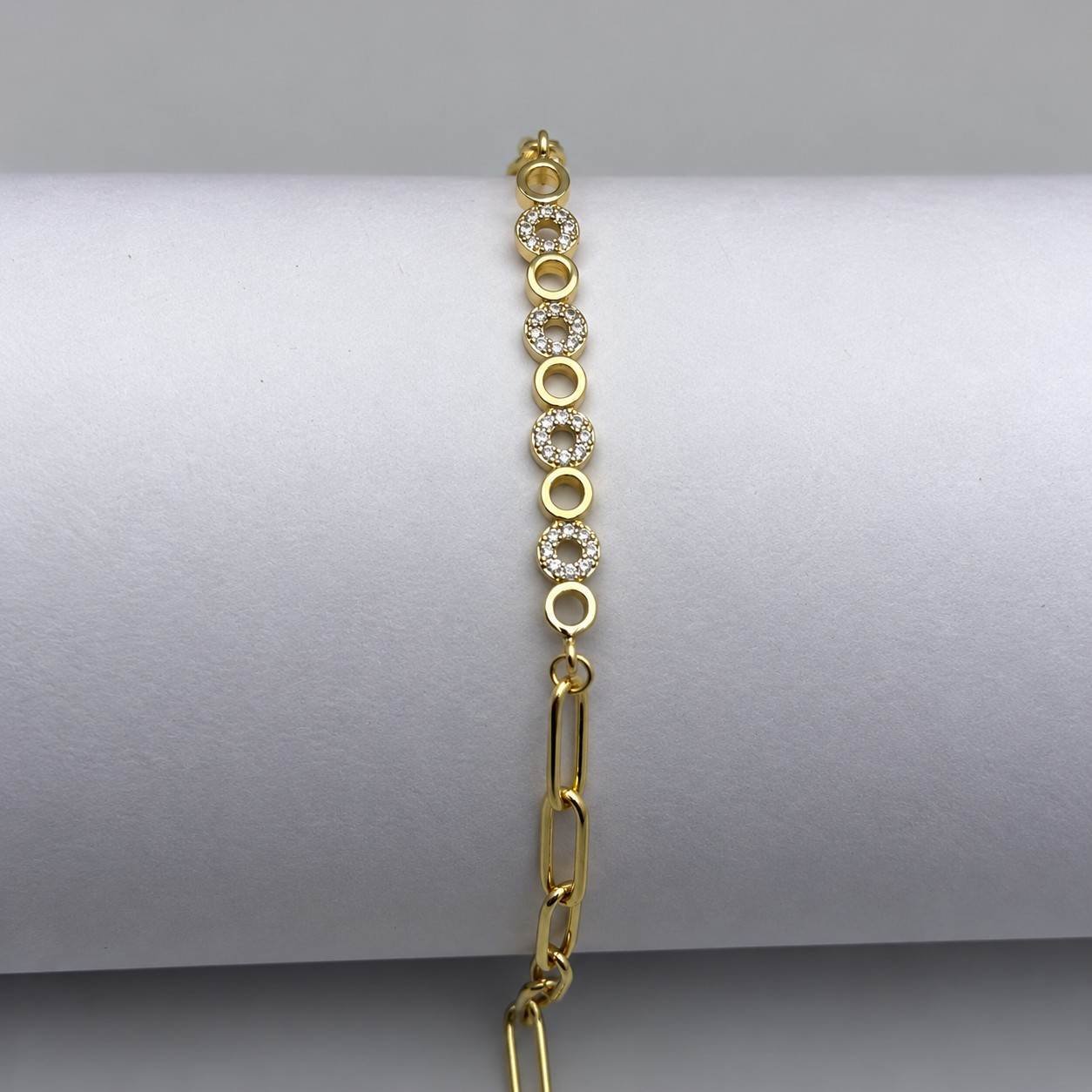 Gold chain bracelet with crystal Multi circle accents and adjustable clasp.