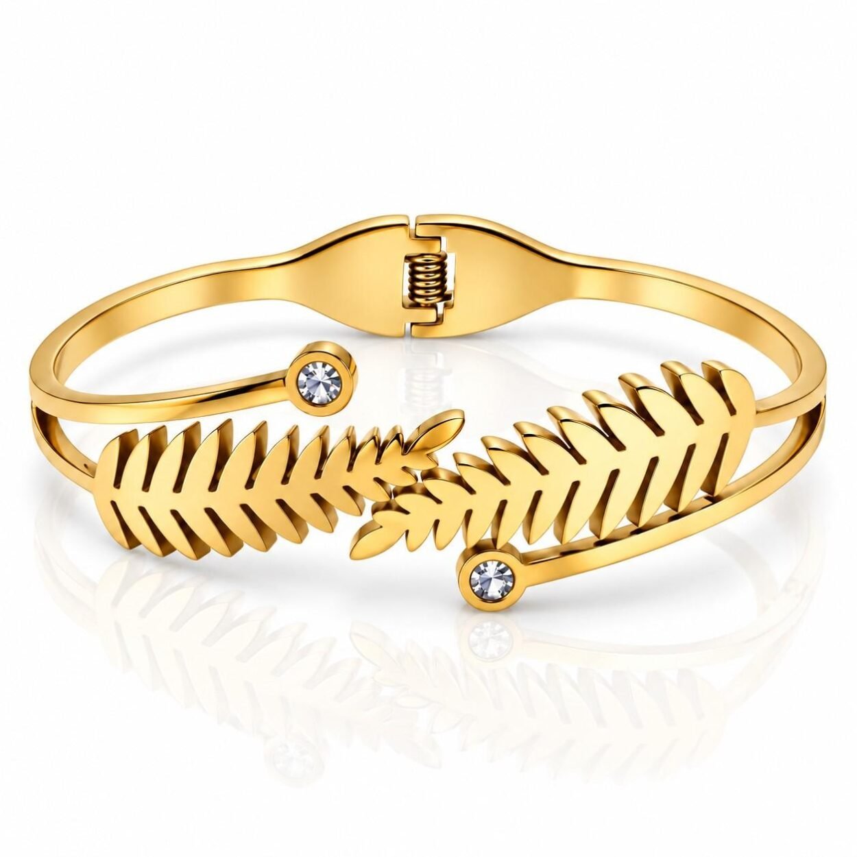 Gold Fern leaf bracelet featuring crystal accents and open cuff design.