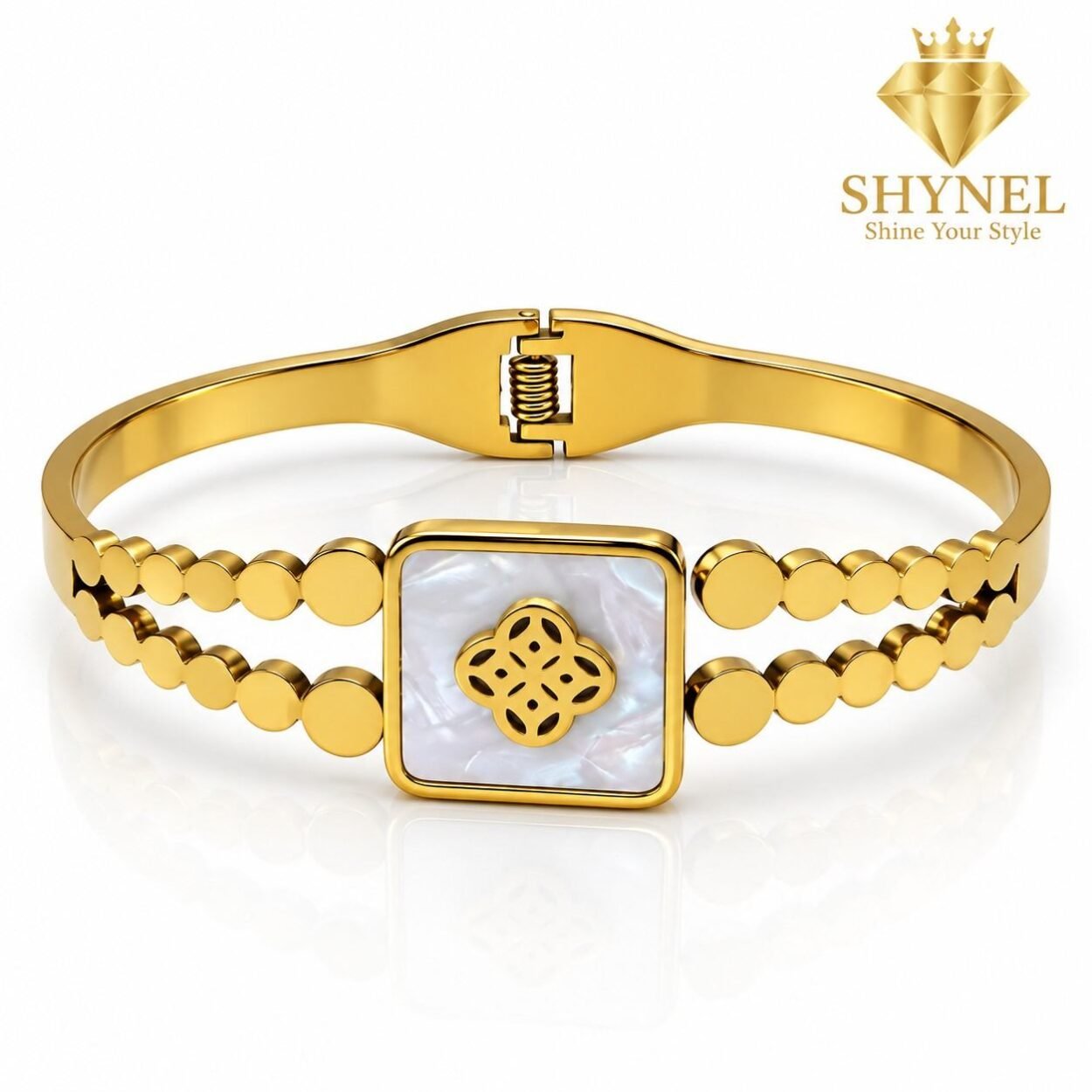 SHYNEL golden bangle bracelet with opalescent clover centerpiece and decorative bead detailing