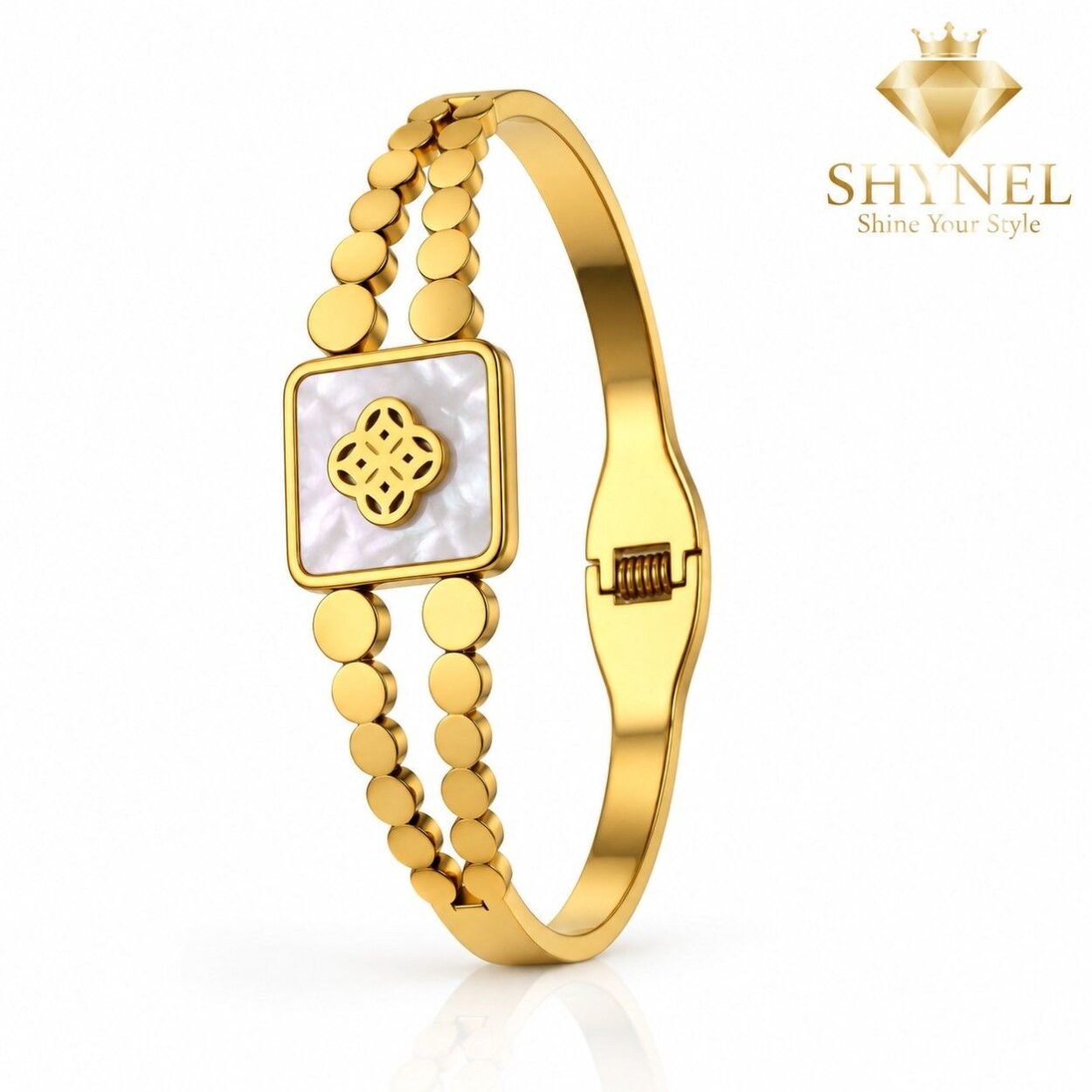 SHYNEL golden bangle bracelet with opalescent clover centerpiece and decorative bead detailing