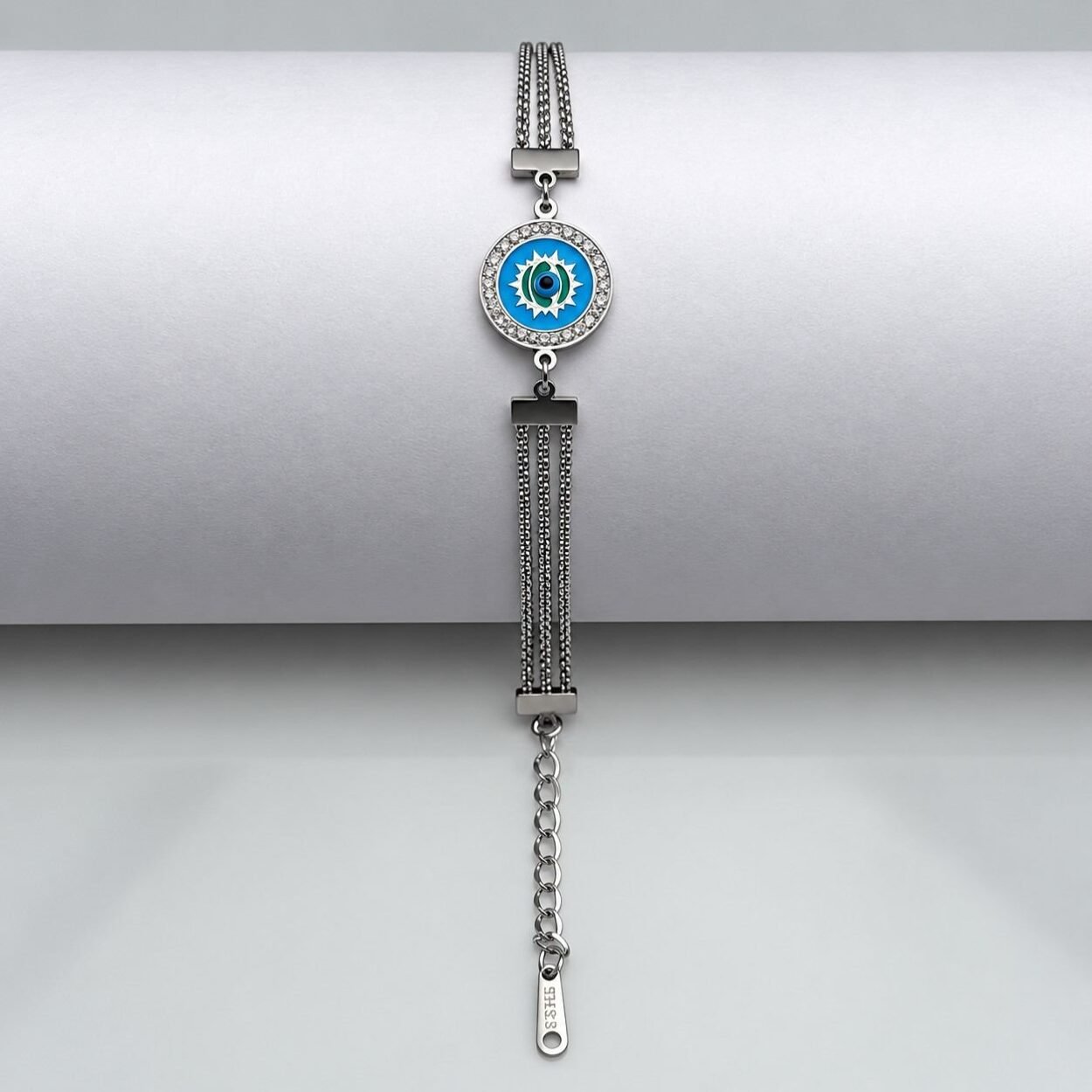 Crafted with a modern silver finish, this adjustable bracelet showcases a classic evil eye charm accented with crystals for a trendy and meaningful look.