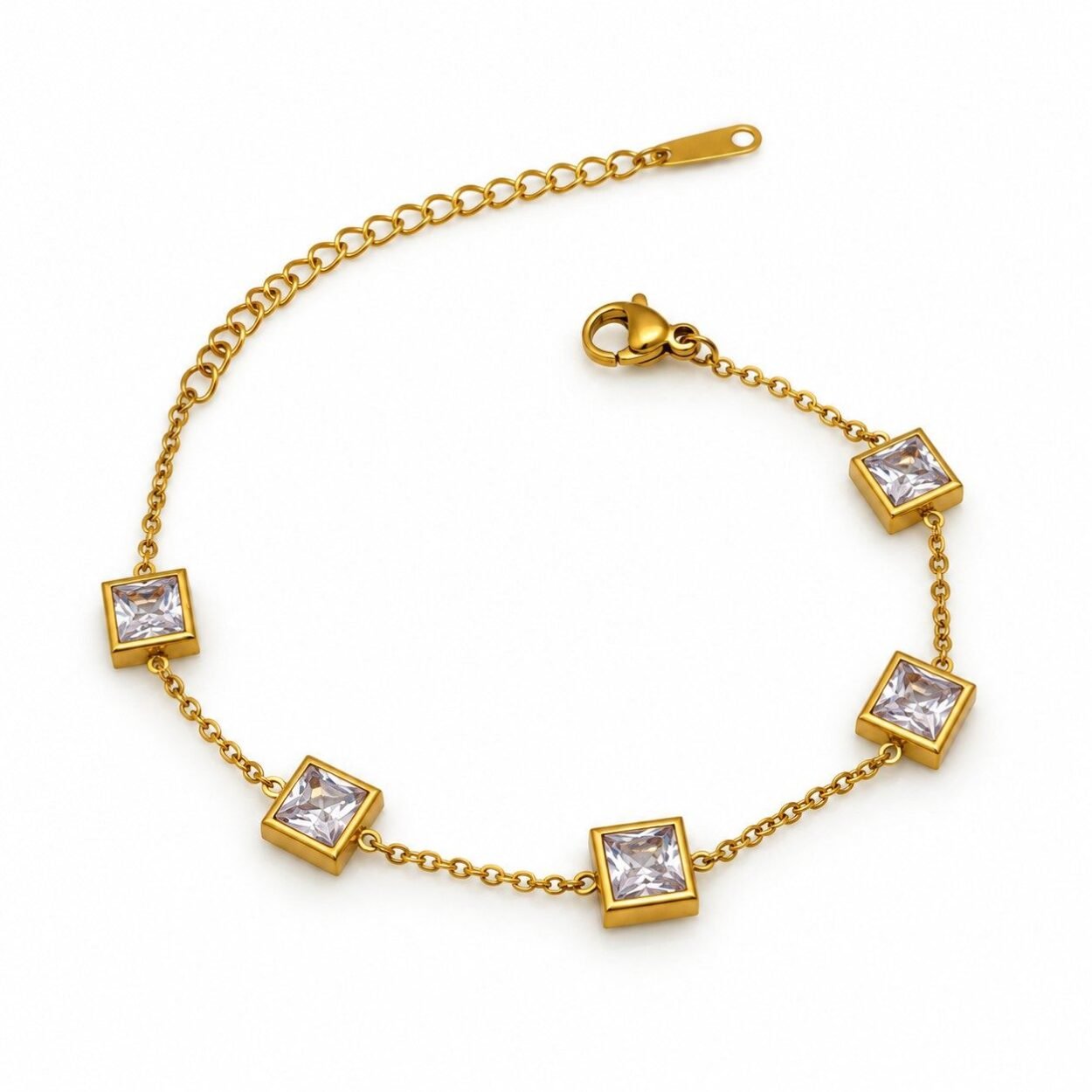 A refined gold-tone bracelet featuring brilliant square-cut crystal stones that add subtle glamour to both casual and formal outfits.